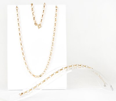 Lot 915 - A 9ct yellow gold open faceted belcher link...