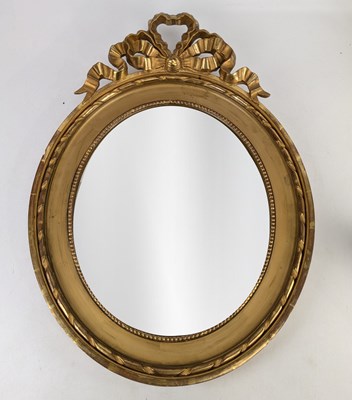 Lot 2288 - An ornate Swedish gilt framed oval wall mirror...