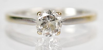 Lot 753 - An 18ct white gold solitaire ring, the diamond...