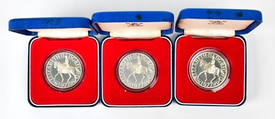 Lot 664 - Three Elizabeth II silver-proof crowns, for...