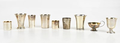 Lot 1469 - Nine Swedish silver tot cups and miniature...