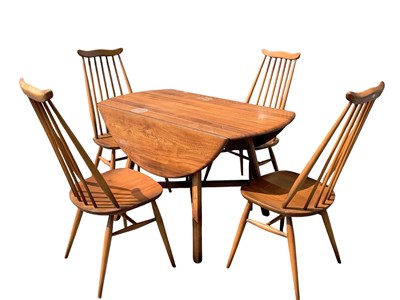 Lot 2198 - ERCOL; a drop-leaf dining table and four...