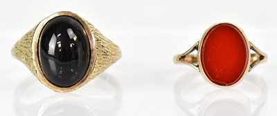 Lot 791 - A 9ct yellow gold bark-effect ring set with an...