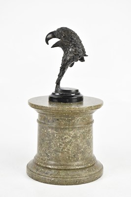 Lot 1414 - A modern bronzed metal eagle's head, on marble...