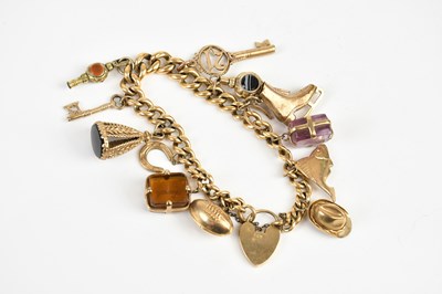 Lot 1581 - An 18ct yellow gold curb link bracelet, with...
