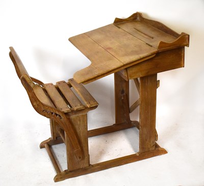 Lot 1696 - A pine school desk