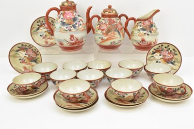 Lot 260 - A Japanese iron red tea set comprising teapot,...
