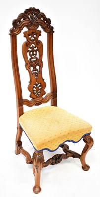 Lot 16 - A contemporary carved walnut high back chair,...