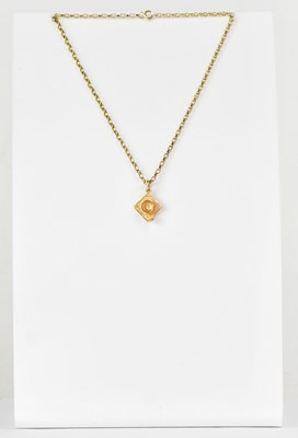 Lot 870 - A 9ct yellow gold pendant in the form of a...