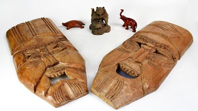 Lot 275 - A pair of large carved masks, each approx. 63...