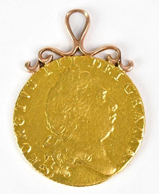 Lot 874 - A George III gold guinea, 1798, with attached...