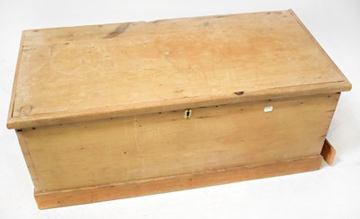 Lot 56 - A small pine trunk with hinged lid and cast...