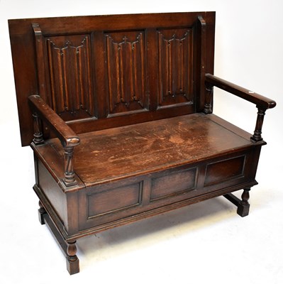 Lot 65 - An early 20th century monk's box seat settle,...