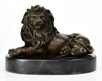 Lot 287 - BARYE; a bronze figure of a reclining lion on...