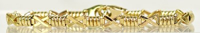 Lot 819 - A 9ct yellow gold fancy link bracelet, length...