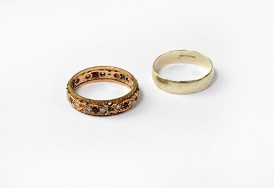 Lot 1092 - A 9ct white gold wedding band, together with a...