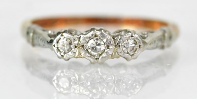 Lot 759 - An 18ct yellow gold ring set with three...
