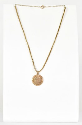 Lot 869 - A 9ct yellow gold 'Gemini' zodiac medallion,...