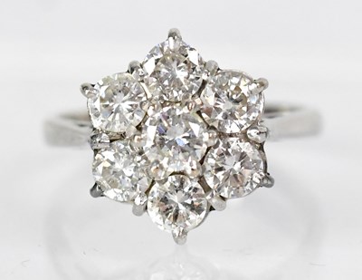 Lot 770 - An 18ct white gold ring set with seven...