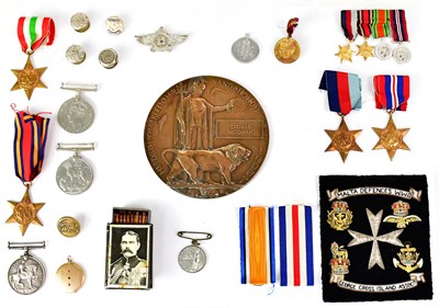 Lot 438 - A collection of WWI and WWII medals and...