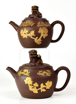 Lot 252 - A pair of Chinese Yixing teapots and covers,...