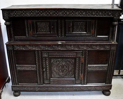 Lot 122a - An 18th century and later carved oak court...
