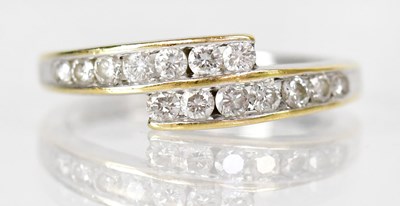 Lot 762 - An 18ct yellow gold split ring set with...