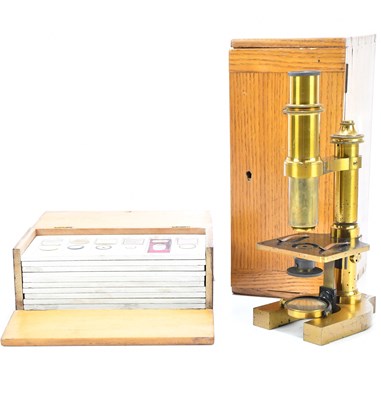 Lot 2441 - R & J BECK, LONDON; a 18879 brass microscope,...