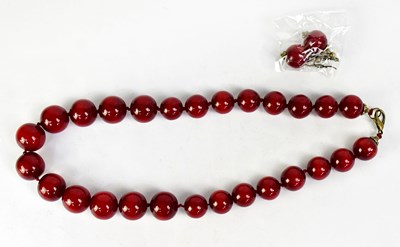 Lot 958 - A cherry amber style resin necklace of...