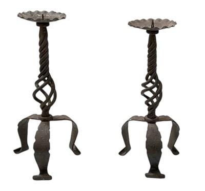 Lot 455 - A pair of early 20th century cast iron tripod...