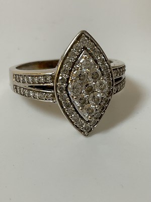 Lot 510 - A 9ct white gold and diamond lozenge shaped...