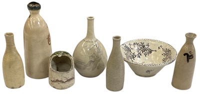 Lot 621 - A Korean iron glazed bulbous form vase,...