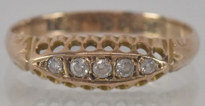 Lot 1180 - A 9ct yellow gold diamond five stone ring,...