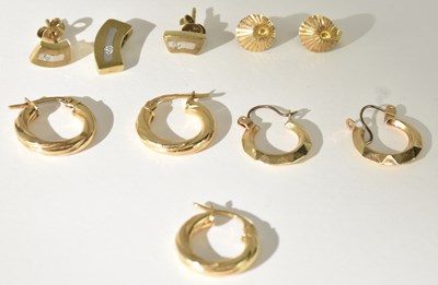 Lot 1262 - Thee 9ct yellow gold hoop twist earrings, a...