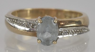Lot 1202 - A 9ct yellow gold blue topaz set ring, central...