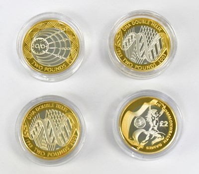 Lot 676 - Four Queen Elizabeth II commemorative £2 coins,...