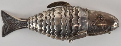 Lot 1110 - A white metal articulated incense burner...