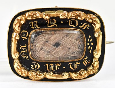 Lot 834 - A yellow metal and black enamel mourning...