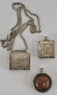 Lot 1358 - A white metal Nepalese miniature Torah holder...