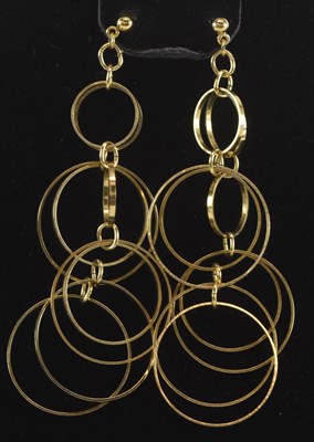 Lot 1260 - A pair of yellow metal hoop tassel earrings,...