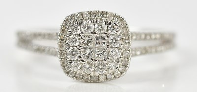 Lot 366 - A 9ct white gold diamond set dress ring, with...