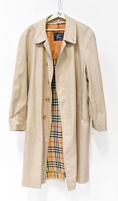Lot 402 - BURBERRYS; a gentlemen's tan overcoat, with...
