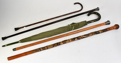 Lot 351 - Four walking canes, to include two George V...
