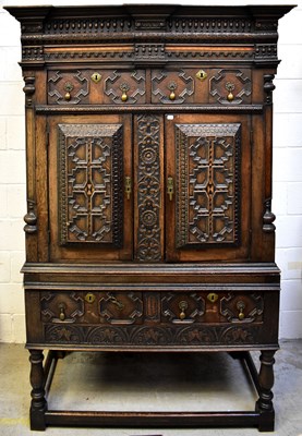 Lot 89 - A large early 20th century oak carved drinks...