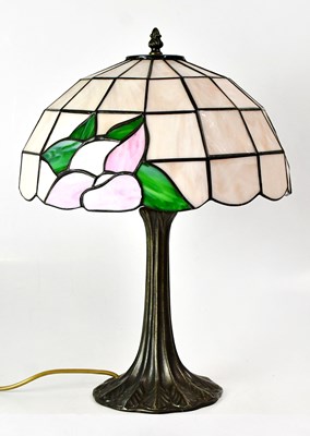 Lot 150 - A Tiffany-style table lamp with cast metal...