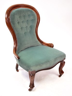 Lot 107 - A Victorian mahogany spoon back nursing chair,...
