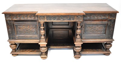 Lot 69 - An early 20th century oak breakfront sideboard...