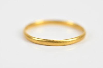 Lot 1606 - A Georgian yellow metal wedding band, size I,...