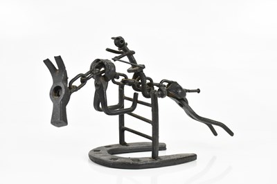 Lot 1420 - A modern decorative model of a horse made from...