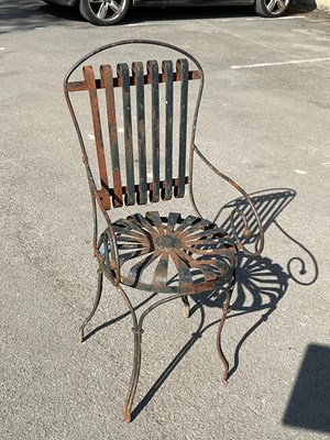 Lot 2346 - A black painted cast iron chair.